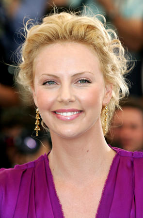 Oscar-winning actress Charlize Theron smiles during a photocall for British director Stephen Hopkins film entry 'The Life and Death of Peter Sellers' which is presented in competition for the Palme d'Or at the 57th Cannes Film Festival, May 21, 2004.